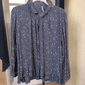 Slate blue blouse & white stars, with Peter Pan collar & ruffled hem. FreePeople